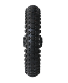 A black bicycle tire featuring a rugged tread pattern designed for off-road cycling, displayed against a stark black background. The tire's sidewall shows detailed tread blocks and grooves, indicating durability and traction suitable for various terrains.